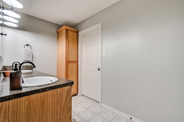 bathroom featuring tile patterned floors and vanity