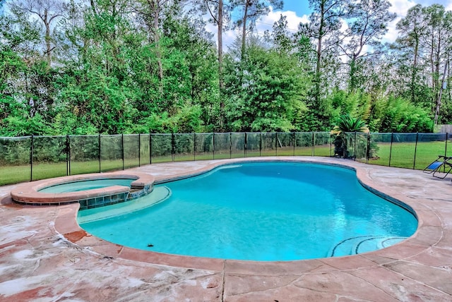 view of swimming pool with an in ground hot tub and a patio area