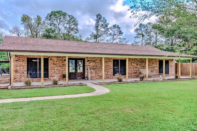 ranch-style home featuring a front yard