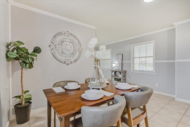 dining space with light tile patterned floors and ornamental molding