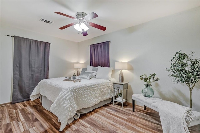 bedroom featuring hardwood / wood-style flooring and ceiling fan