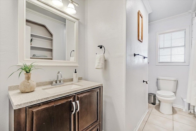 bathroom featuring crown molding, toilet, tile patterned floors, and vanity