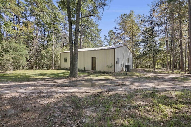 view of outdoor structure featuring central AC