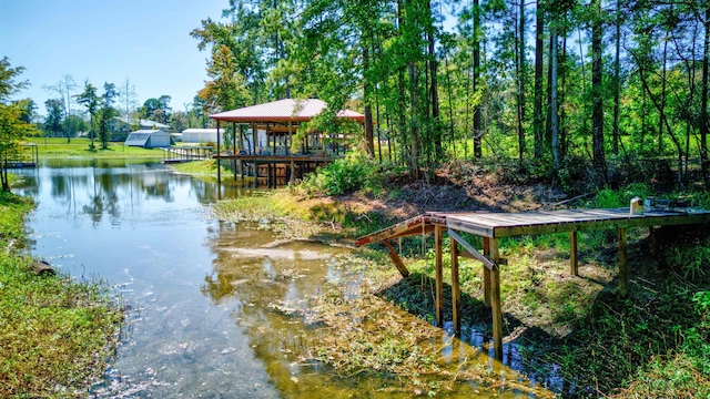 view of dock featuring a gazebo and a water view