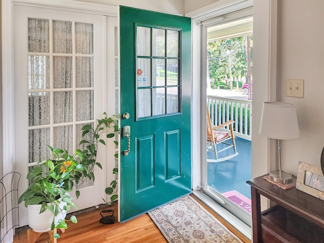 doorway with hardwood / wood-style flooring