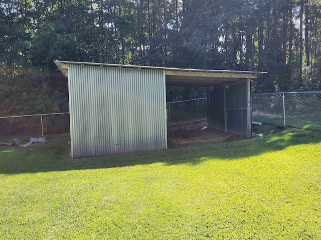 view of outbuilding with a yard and a carport