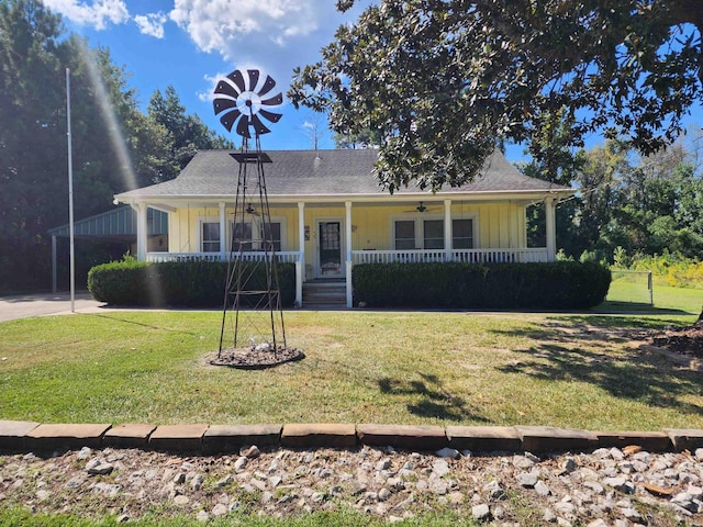 view of front of house with covered porch and a front yard