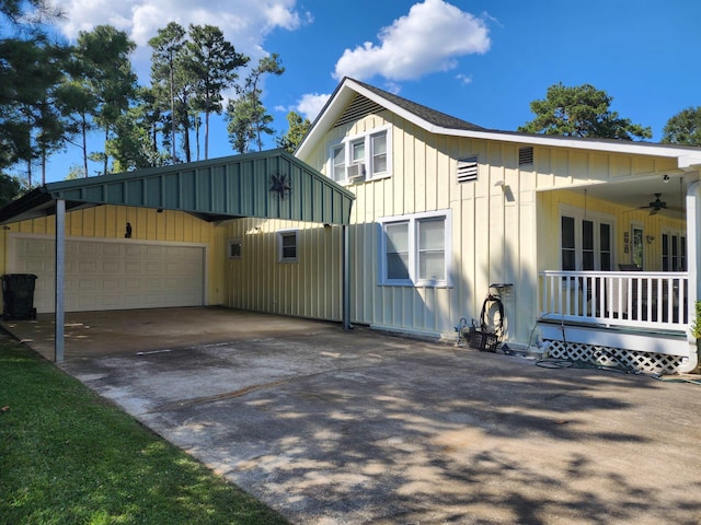 view of home's exterior with a garage and ceiling fan