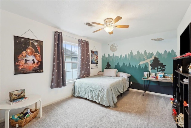 carpeted bedroom featuring visible vents, baseboards, and a ceiling fan