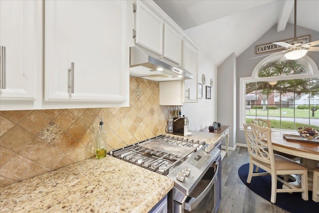 kitchen featuring backsplash, vaulted ceiling with beams, under cabinet range hood, stainless steel range with gas stovetop, and white cabinets