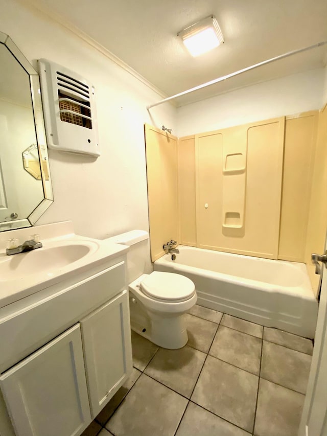 full bathroom featuring tile patterned floors, bathtub / shower combination, vanity, crown molding, and toilet