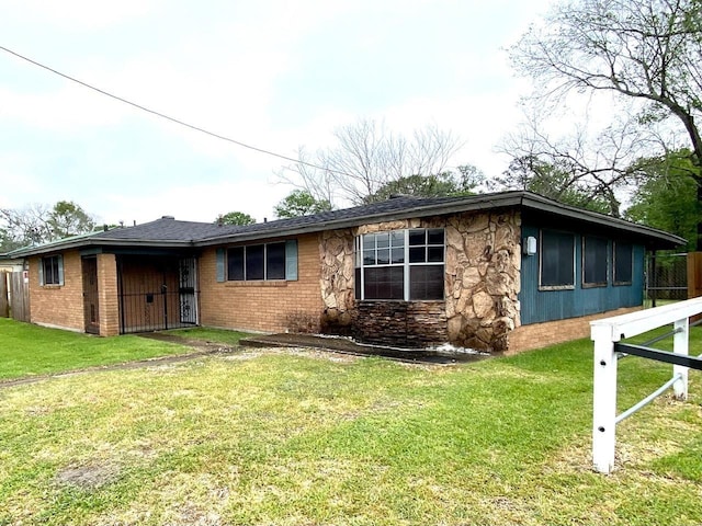 back of property featuring a lawn