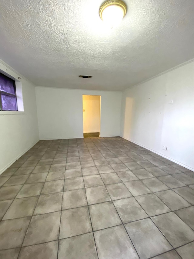 basement featuring a textured ceiling