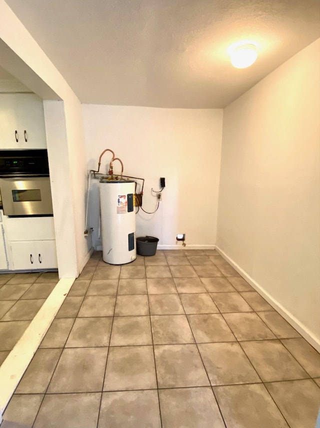 utility room featuring electric water heater