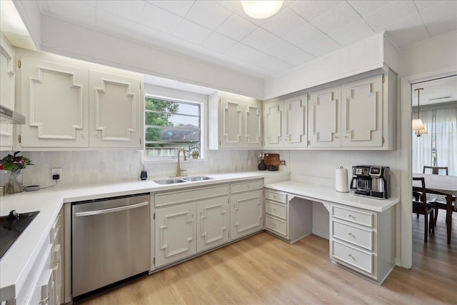1210 Nottingham Ln, Beaumont, TX 77706 - kitchen featuring dishwasher, a sink, plenty of natural light, and light wood-type flooring
