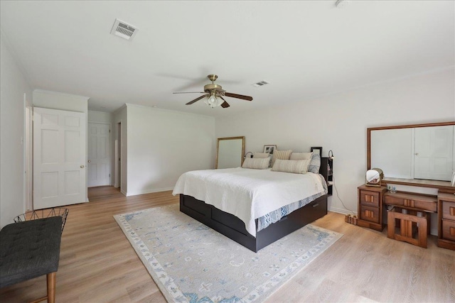 1210 Nottingham Ln, Beaumont, TX 77706 - bedroom with light wood-style floors, a ceiling fan, and baseboards