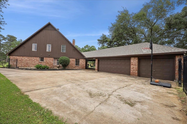 1210 Nottingham Ln, Beaumont, TX 77706 - view of side of property with brick siding, driveway, a chimney, and a shingled roof