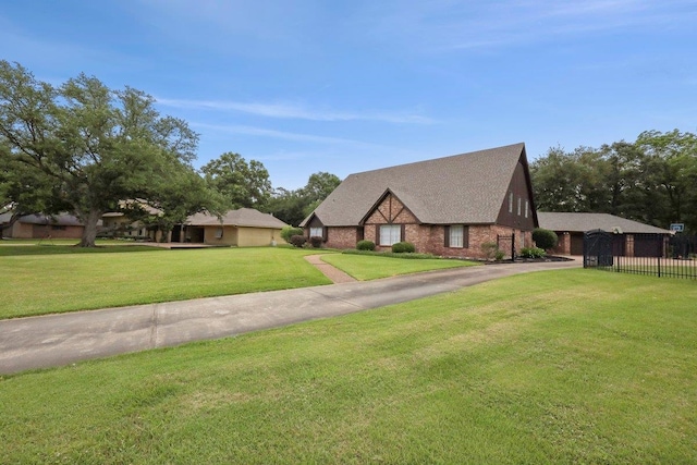 1210 Nottingham Ln, Beaumont, TX 77706 - english style home with driveway, brick siding, and a shingled roof
