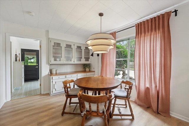 1210 Nottingham Ln, Beaumont, TX 77706 - dining space with light wood finished floors and baseboards