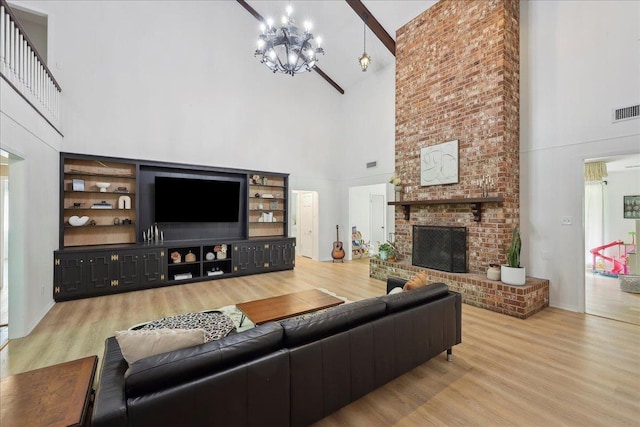 1210 Nottingham Ln, Beaumont, TX 77706 - living area with high vaulted ceiling, wood finished floors, a chandelier, a brick fireplace, and beam ceiling