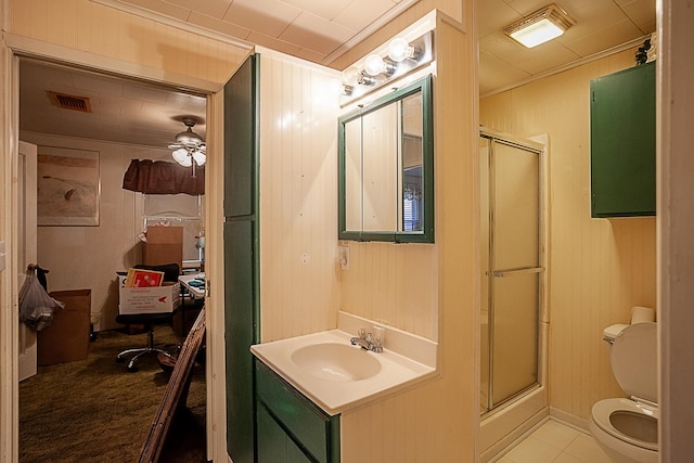 bathroom with visible vents, toilet, and a stall shower