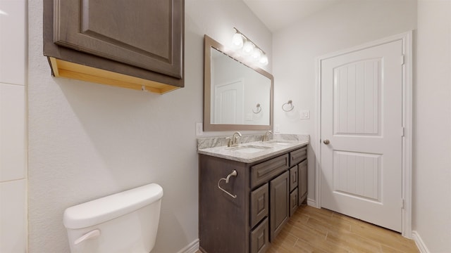 225 Sycamore Ct, Lumberton, TX 77657 - bathroom featuring double vanity and wood finished floors