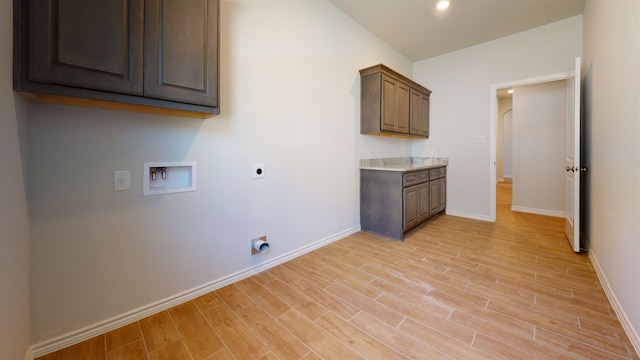 225 Sycamore Ct, Lumberton, TX 77657 - laundry area with hookup for an electric dryer, hookup for a washing machine, cabinet space, light wood-style floors, and recessed lighting