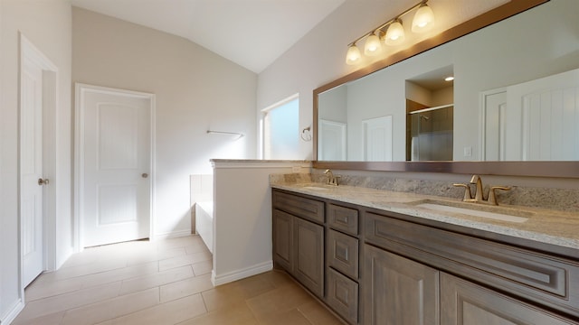 225 Sycamore Ct, Lumberton, TX 77657 - bathroom featuring double vanity, lofted ceiling, an enclosed shower, a garden tub, and tile patterned flooring