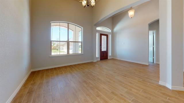 225 Sycamore Ct, Lumberton, TX 77657 - entryway with arched walkways and light wood-style flooring