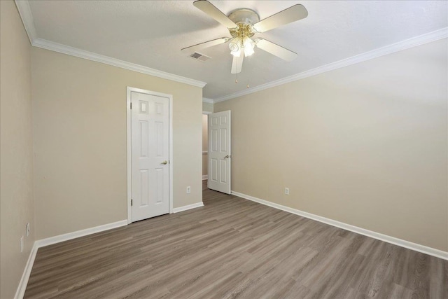 5210 Ada Ave, Beaumont, TX 77708 - unfurnished bedroom featuring wood finished floors, baseboards, crown molding, and a ceiling fan
