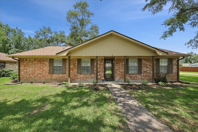 5210 Ada Ave, Beaumont, TX 77708 - ranch-style house with a front yard and brick siding