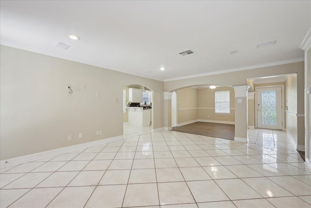 5210 Ada Ave, Beaumont, TX 77708 - unfurnished room with ornamental molding, arched walkways, light tile patterned floors, baseboards, and recessed lighting
