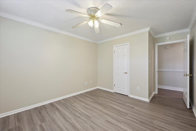 5210 Ada Ave, Beaumont, TX 77708 - unfurnished bedroom featuring wood finished floors, baseboards, ornamental molding, and ceiling fan