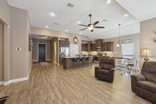 living room featuring ceiling fan, light wood-type flooring, baseboards, recessed lighting, and vaulted ceiling