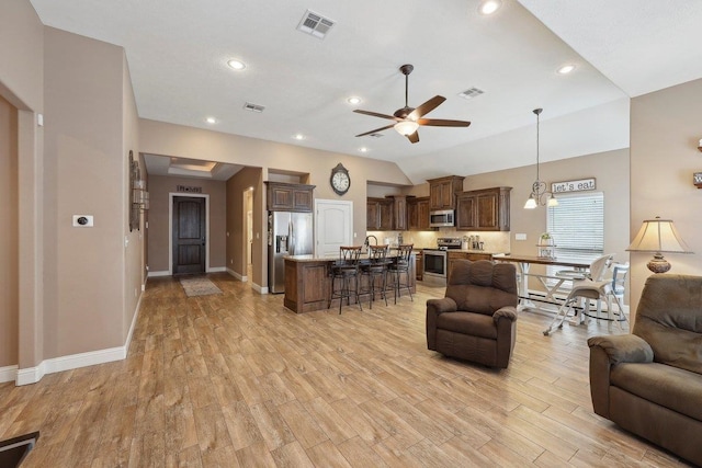 living area with a ceiling fan, light wood-style flooring, baseboards, lofted ceiling, and recessed lighting