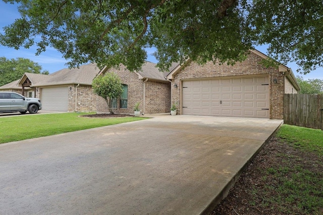 view of front of property featuring brick siding, concrete driveway, and a garage