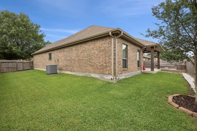 view of property exterior featuring brick siding and central air condition unit