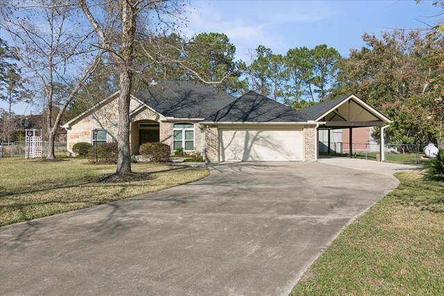 ranch-style house with a front yard, a garage, and a carport