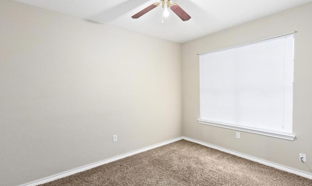 empty room featuring carpet and ceiling fan