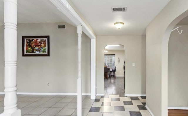 hallway featuring light tile patterned floors