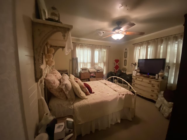 bedroom featuring ceiling fan and ornamental molding