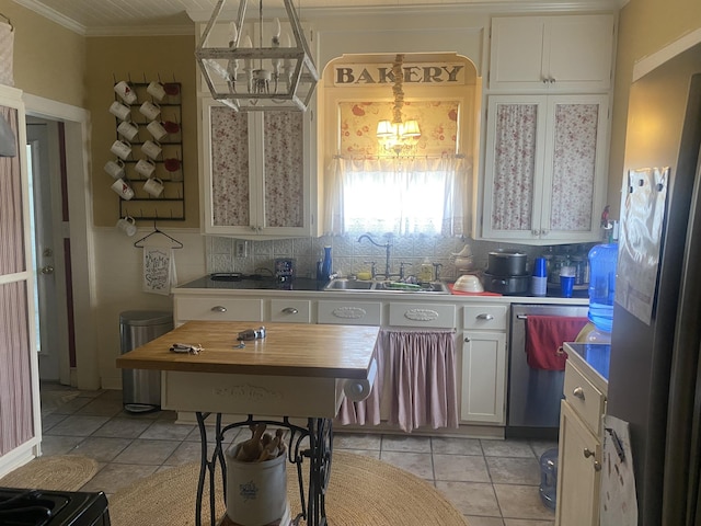 kitchen with white cabinetry, sink, light tile patterned floors, and appliances with stainless steel finishes