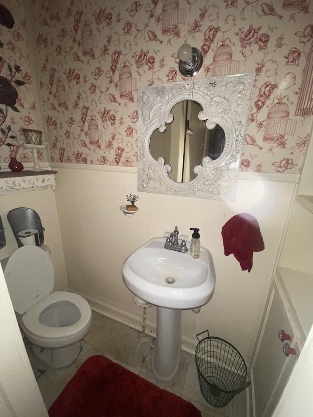 bathroom with tile patterned floors and toilet