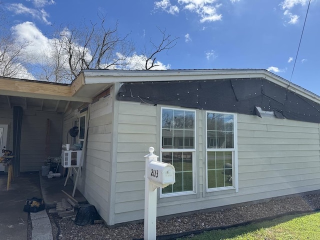 view of home's exterior with cooling unit