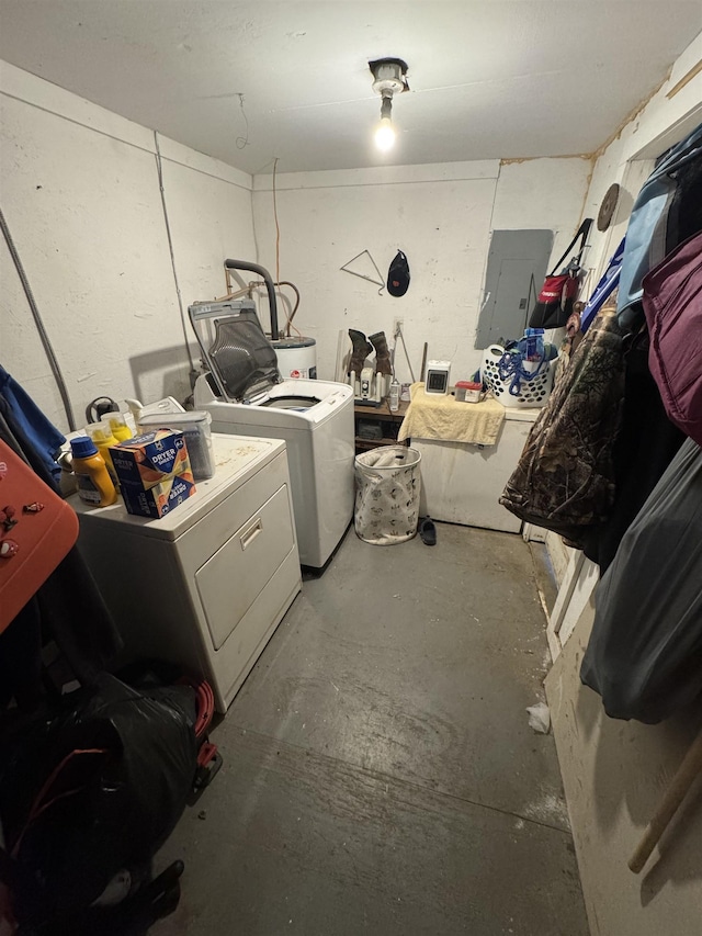 washroom featuring electric panel, laundry area, and washing machine and dryer