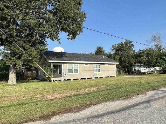 view of side of property with a yard