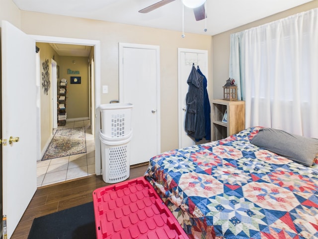 bedroom featuring a closet, a ceiling fan, and wood finished floors