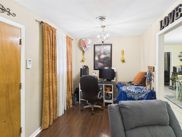 office featuring visible vents, dark wood finished floors, and a chandelier