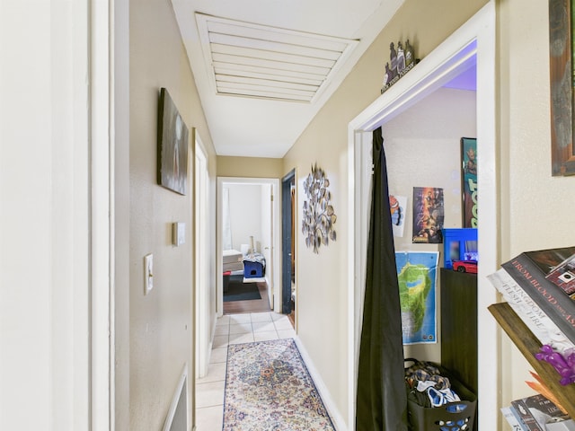 hallway featuring light tile patterned floors