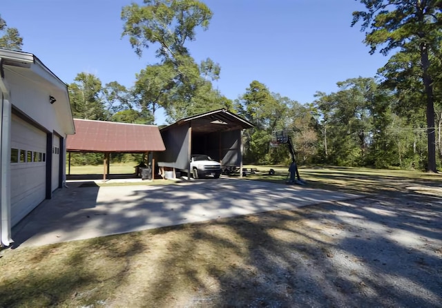 exterior space with a carport and a garage